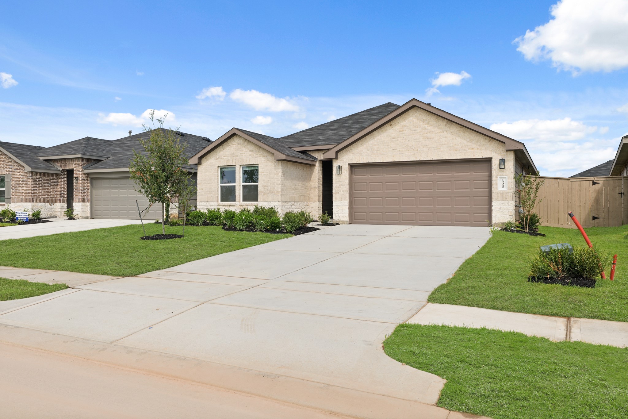 14392 Oceanblue Way Splendora, TX 77372 - Photo 3 of 30 a front view of a house with a yard and garage