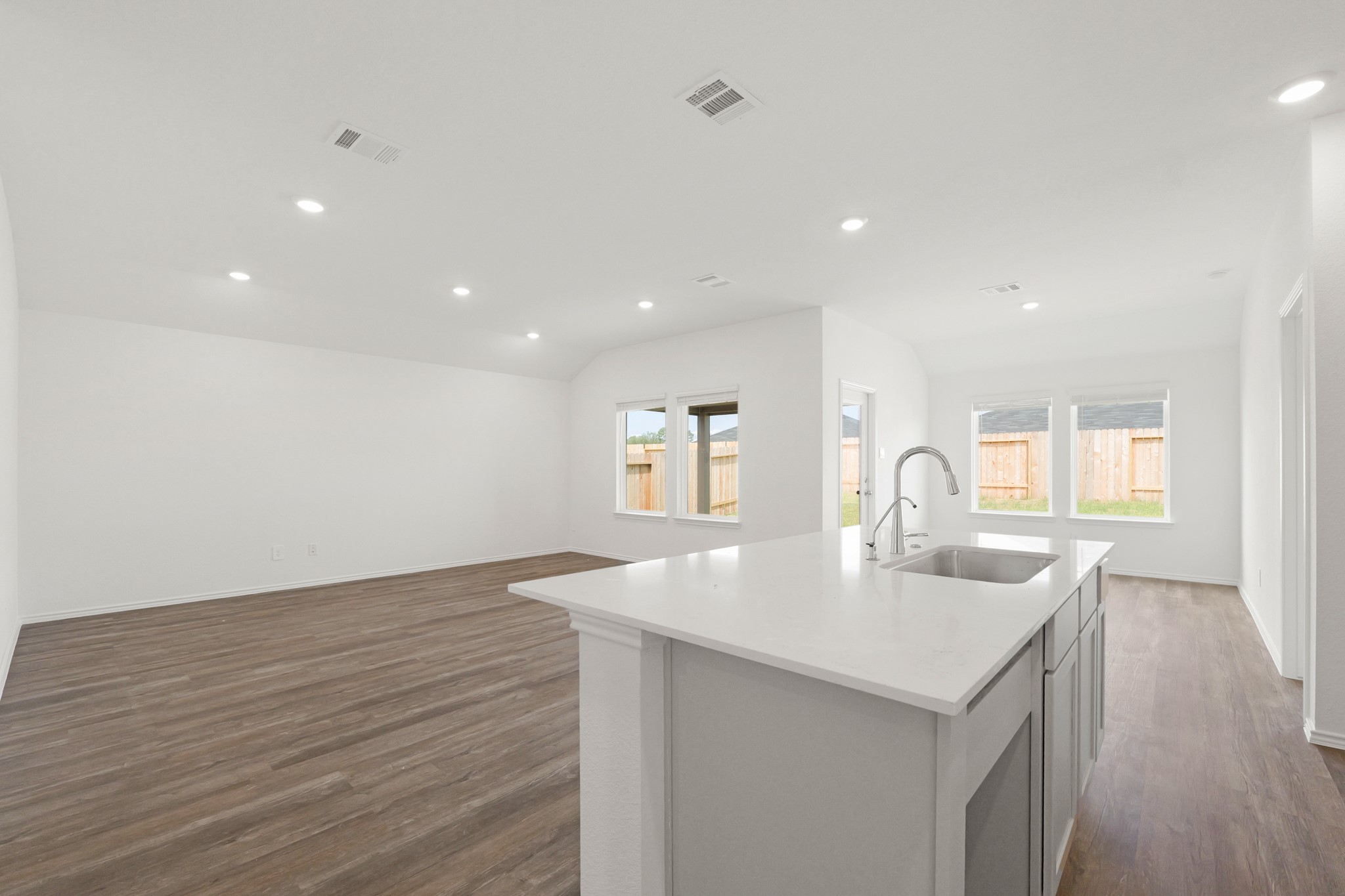 14392 Oceanblue Way Splendora, TX 77372 - Photo 6 of 30 a kitchen with sink and mirror