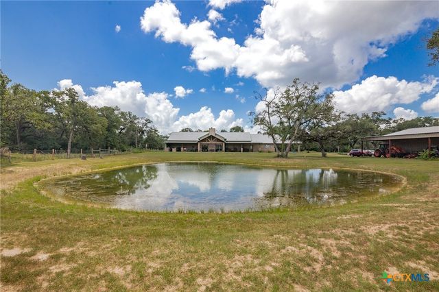 a view of a lake with houses in the background
