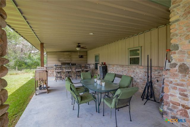 a dining room with furniture and a garden