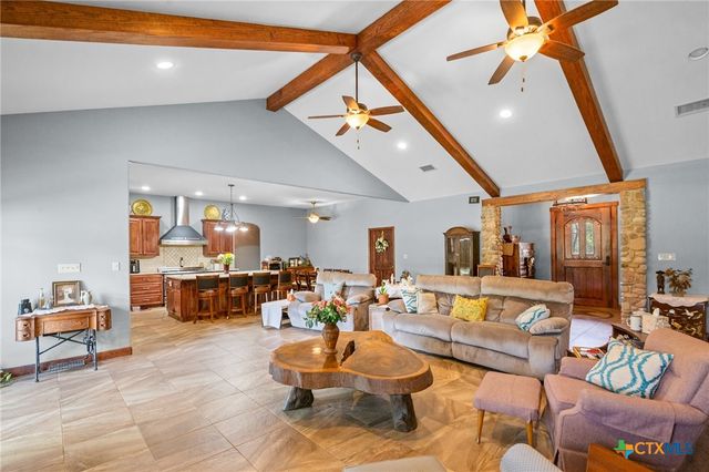 a bathroom with a toilet and shower curtain