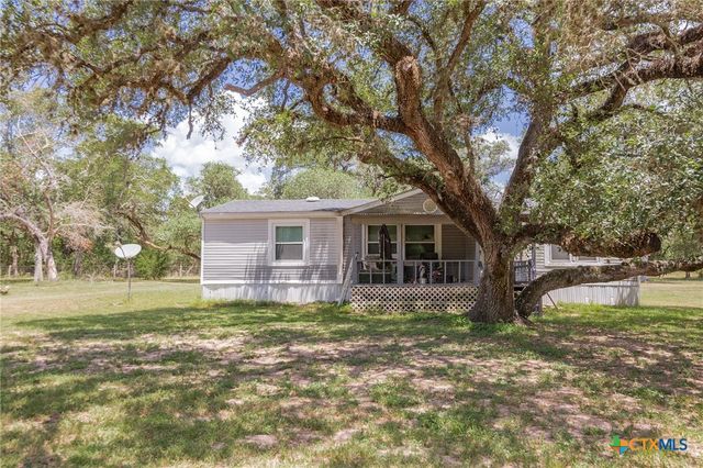 a view of swimming pool from a yard