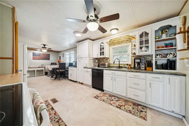 a kitchen with cabinets and window