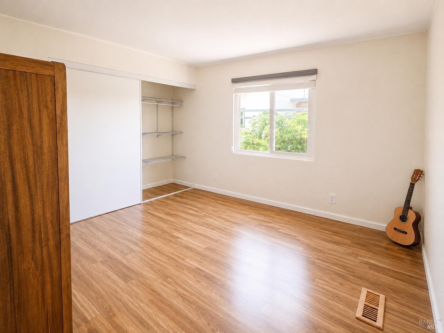 1945 Piner Road, Unit 16 Santa Rosa, CA 95403 - Photo 14 of 18 a view of empty room with wooden floor and fan