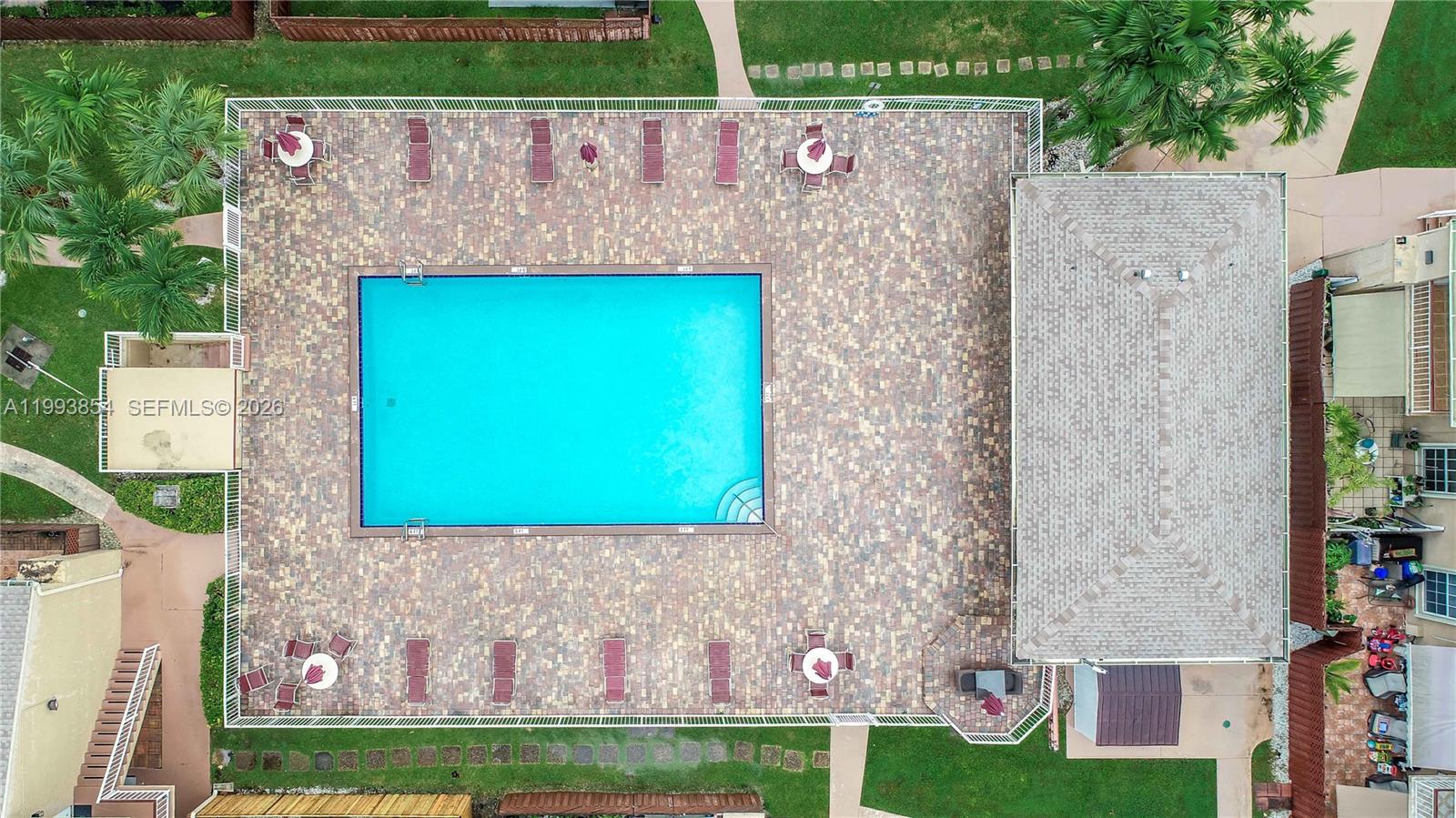 13785 Southwest 66th Street, Unit 239C Miami, FL 33183 - Photo 1 of 17 a aerial view of a house with a yard and large trees