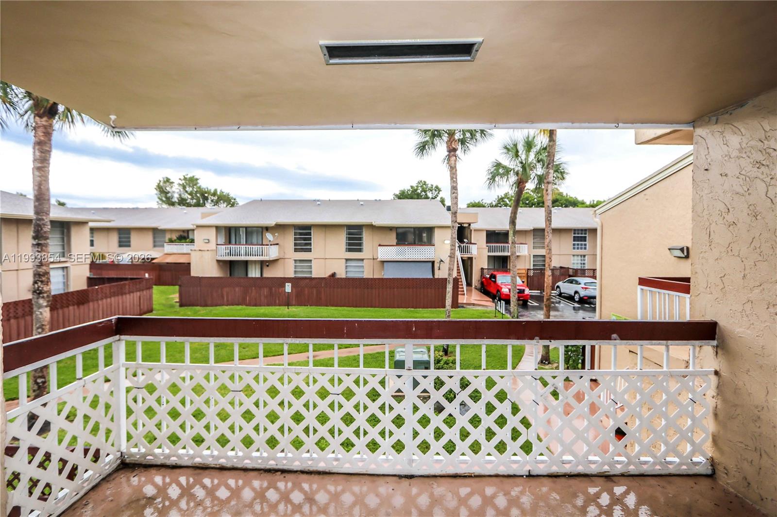 13785 Southwest 66th Street, Unit 239C Miami, FL 33183 - Photo 16 of 17 a picture of a bench in front of building