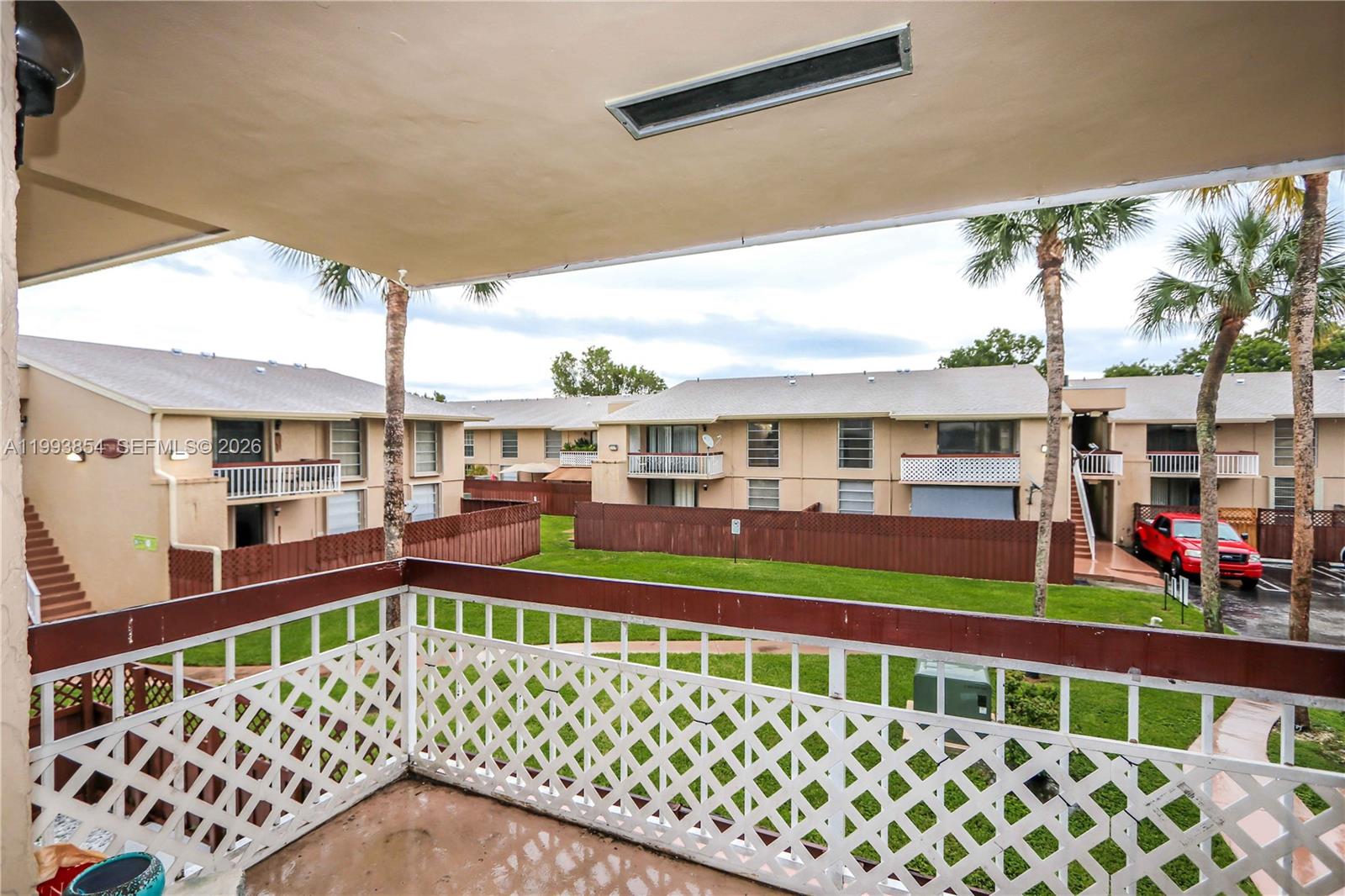 13785 Southwest 66th Street, Unit 239C Miami, FL 33183 - Photo 17 of 17 a front view of a house with a porch