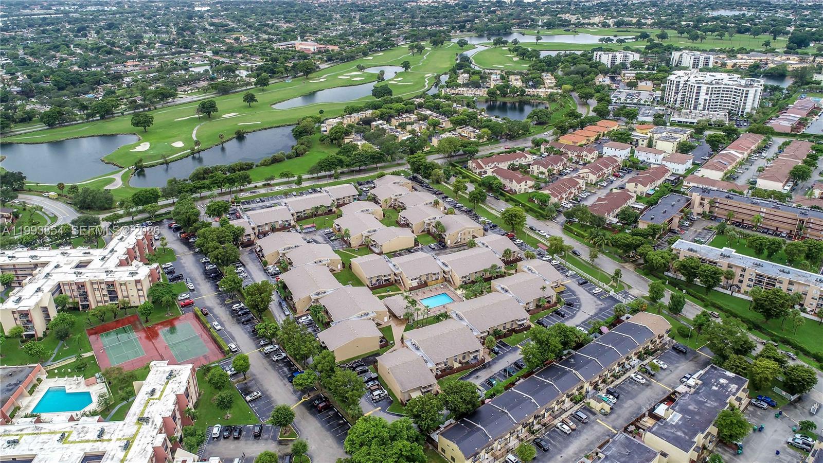 13785 Southwest 66th Street, Unit 239C Miami, FL 33183 - Photo 6 of 17 an aerial view of residential houses with outdoor space