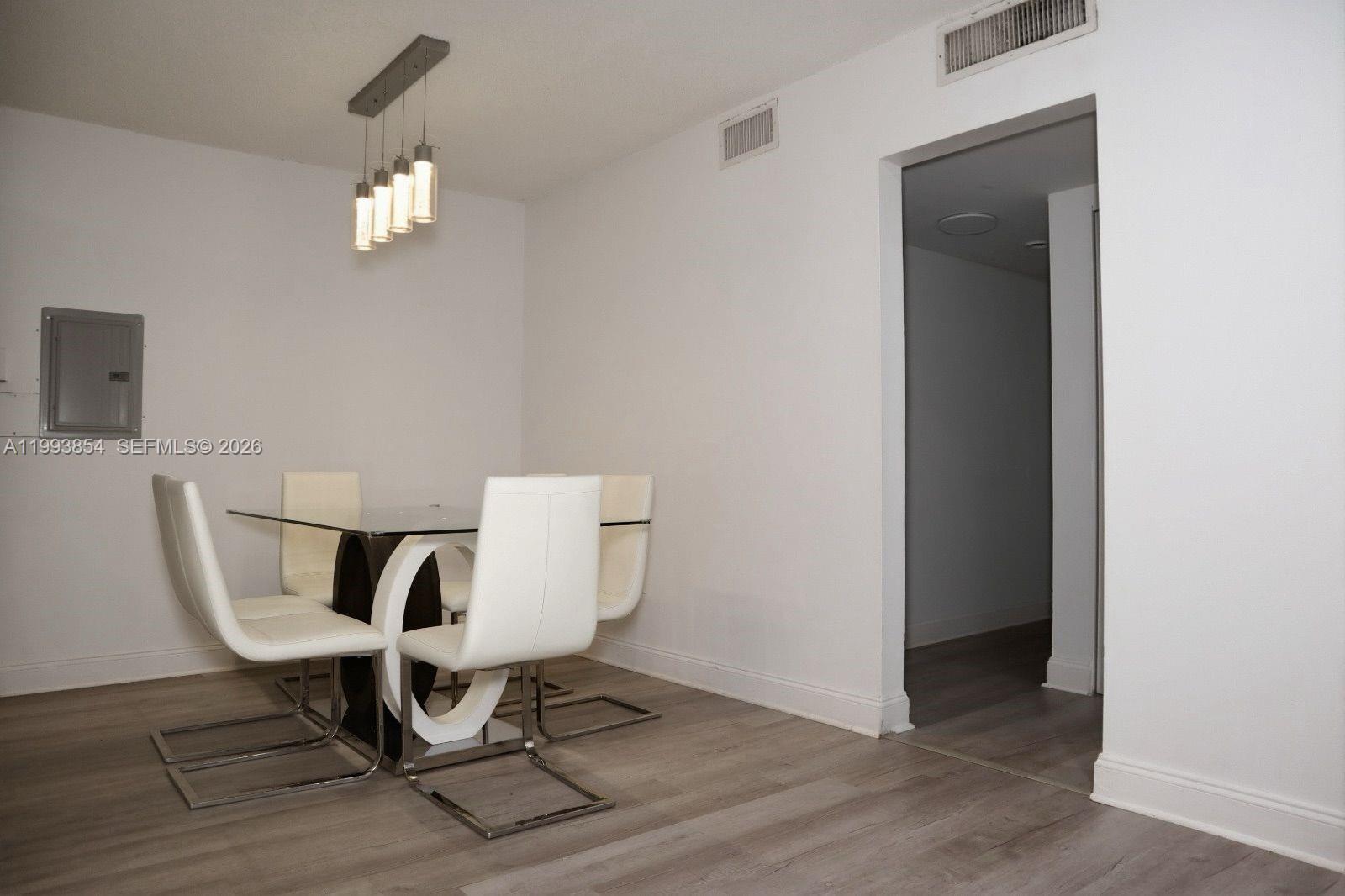 13785 Southwest 66th Street, Unit 239C Miami, FL 33183 - Photo 8 of 17 a work room with furniture and a potted plant