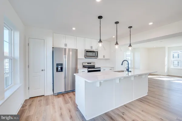 a view of a kitchen and sink hardwood floor