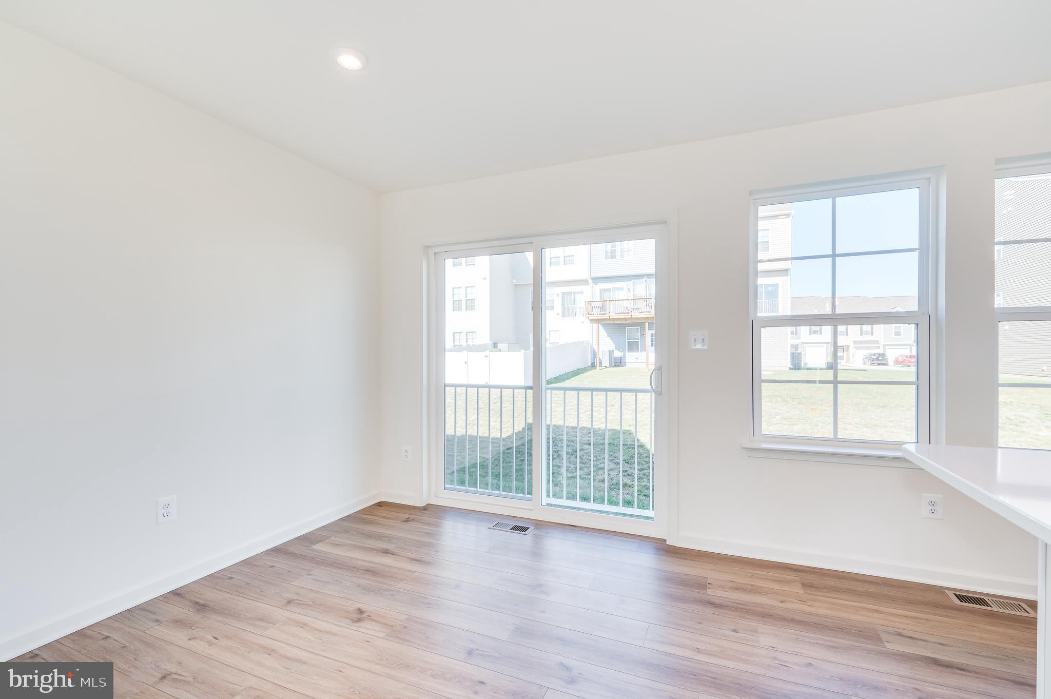115 Tuxford Road Falling Waters, WV 25419 - Photo 24 of 44 an empty room with wooden floor and windows