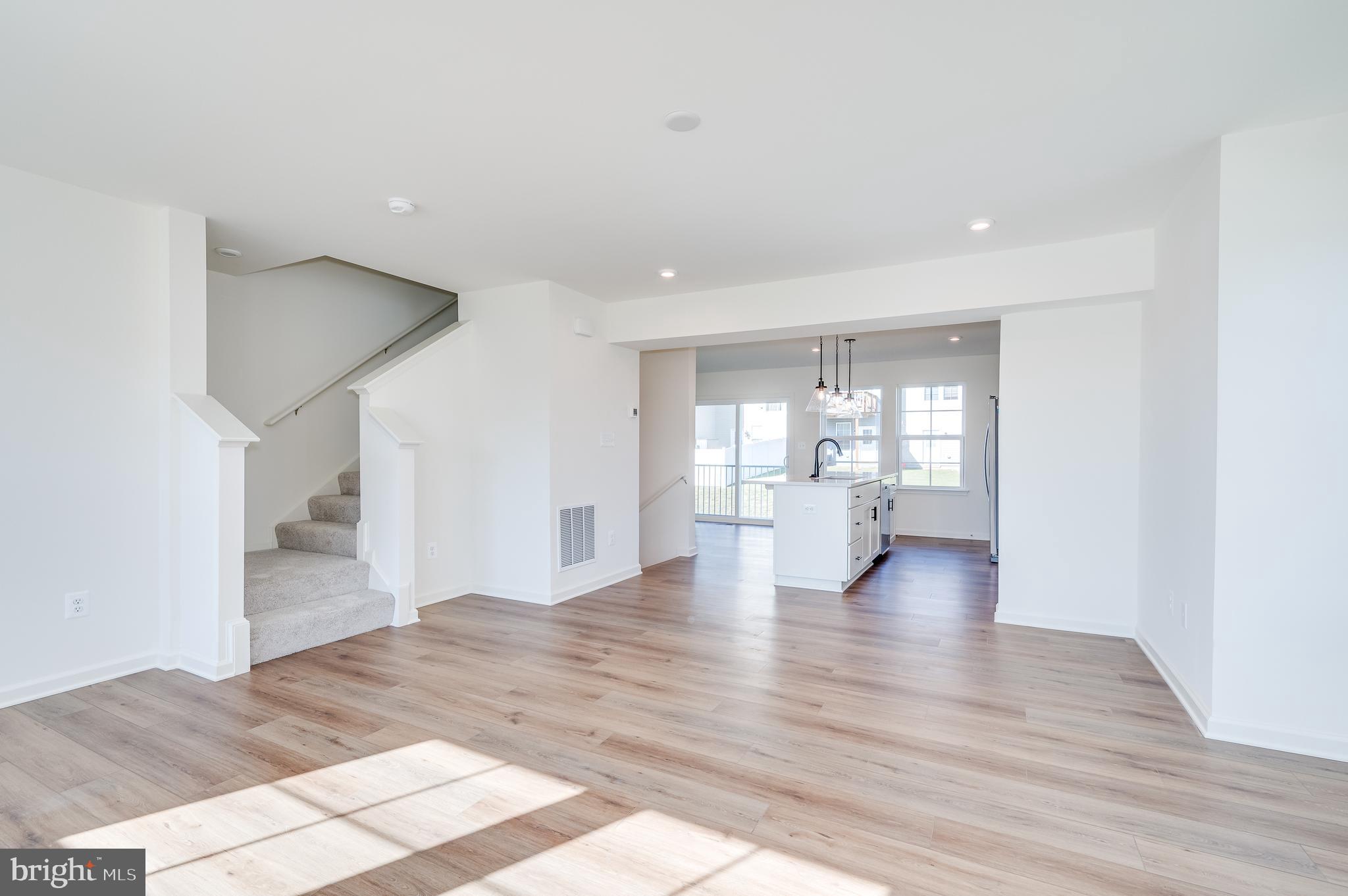 115 Tuxford Road Falling Waters, WV 25419 - Photo 27 of 44 a view of an empty room with wooden floor and a window