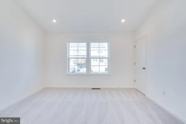 an empty room with closet area