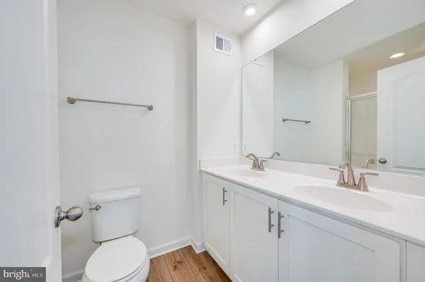 a bathroom with a glass shower door