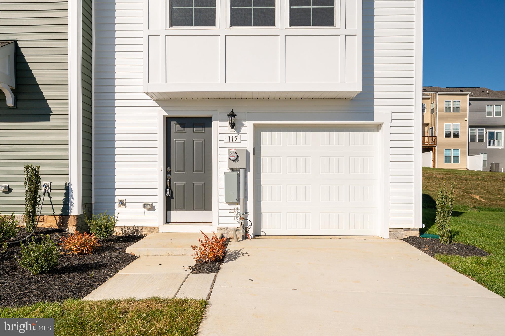 115 Tuxford Road Falling Waters, WV 25419 - Photo 4 of 44 a front view of a house with a yard