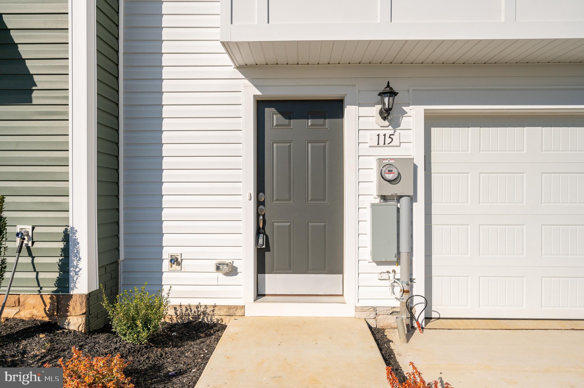 115 Tuxford Road Falling Waters, WV 25419 - Photo 5 of 44 a front view of a house with a outdoor space