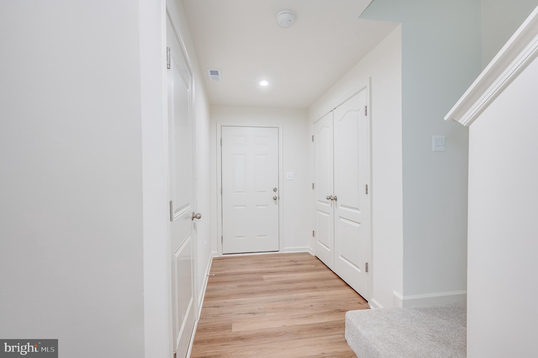 115 Tuxford Road Falling Waters, WV 25419 - Photo 10 of 44 a view of a hallway with wooden floor