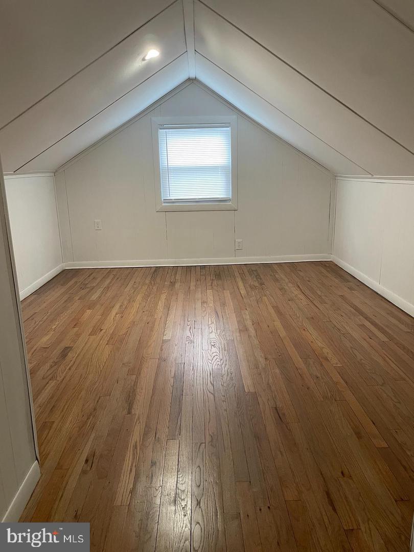 105 Breslin Avenue Haddonfield, NJ 08033 - Photo 12 of 15 an empty room with wooden floor and windows