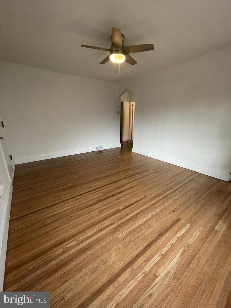 105 Breslin Avenue Haddonfield, NJ 08033 - Photo 6 of 15 a view of an empty room and chandelier fan