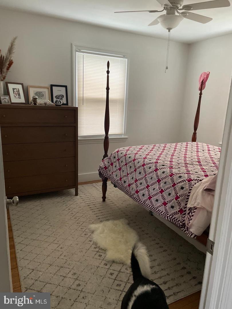 105 Breslin Avenue Haddonfield, NJ 08033 - Photo 9 of 15 a bed sitting in a bedroom next to a window