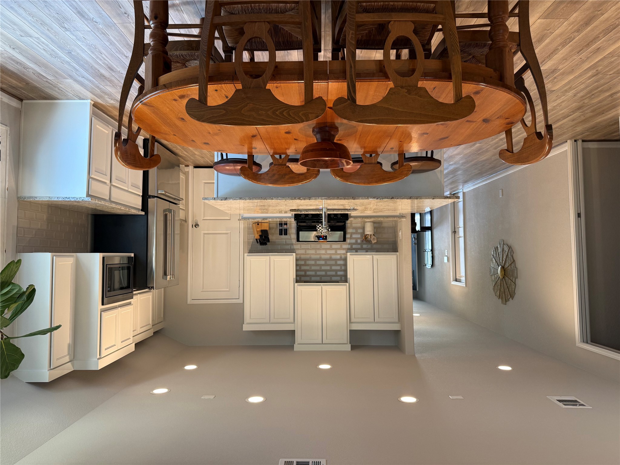 2336 Hagerman Road Conroe, TX 77384 - Photo 6 of 35 a large kitchen with a table and chairs in it