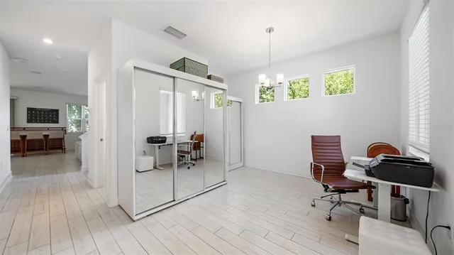 a spacious bedroom with a bed and window