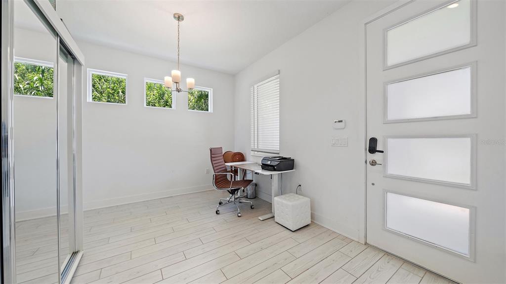 2587 Temple Street Sarasota, FL 34239 - Photo 17 of 54 a bathroom with a window