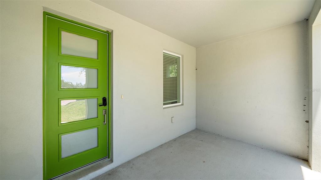2587 Temple Street Sarasota, FL 34239 - Photo 19 of 54 a room with window and mirror