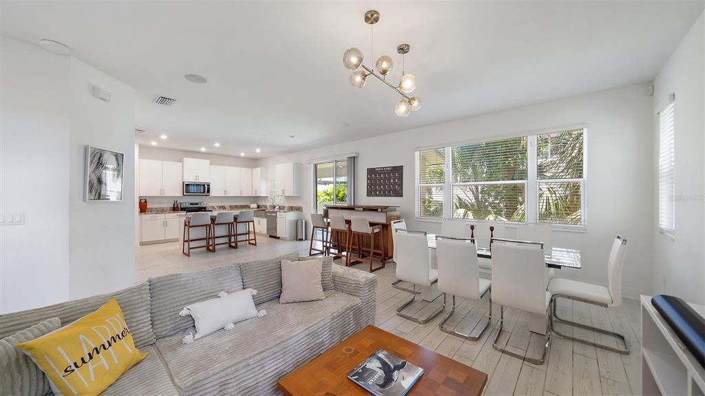 2587 Temple Street Sarasota, FL 34239 - Photo 2 of 54 a living room with furniture and wooden floor