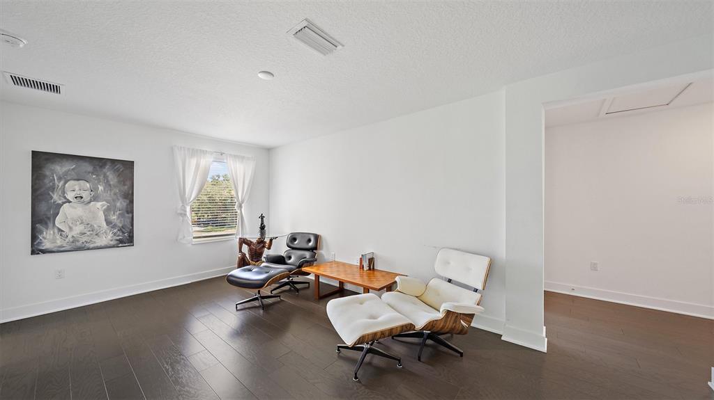 2587 Temple Street Sarasota, FL 34239 - Photo 21 of 54 a living room with furniture and a window