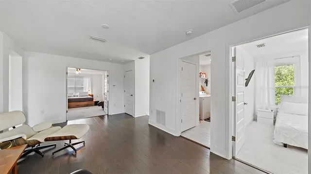 a bedroom with a bed and a chair