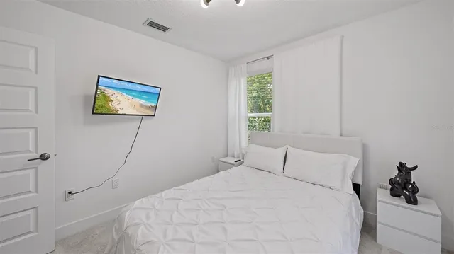 an aerial view of a house with a garden