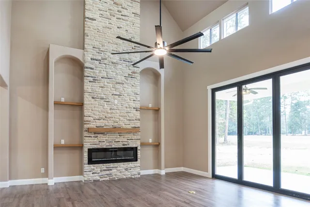 a kitchen with kitchen island granite countertop a sink a counter top space stainless steel appliances and cabinets