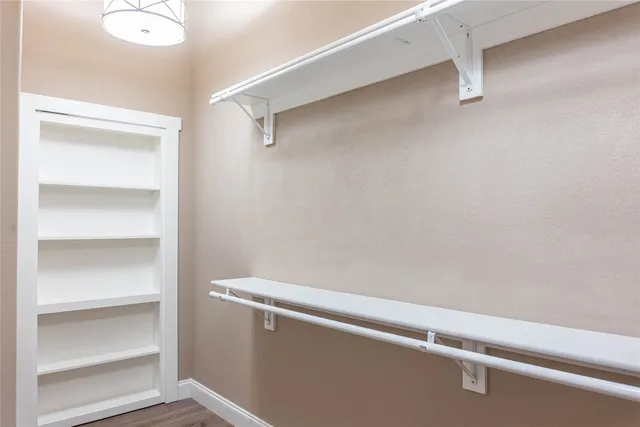 a bathroom with a double vanity sink a mirror and a window