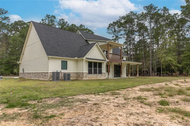 a view of an entryway with wooden floor and door