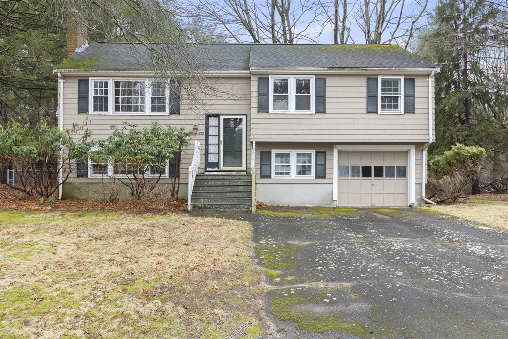283 Orchard Street Millis, MA 02054 - Photo 1 of 41 a front view of a house with a garden