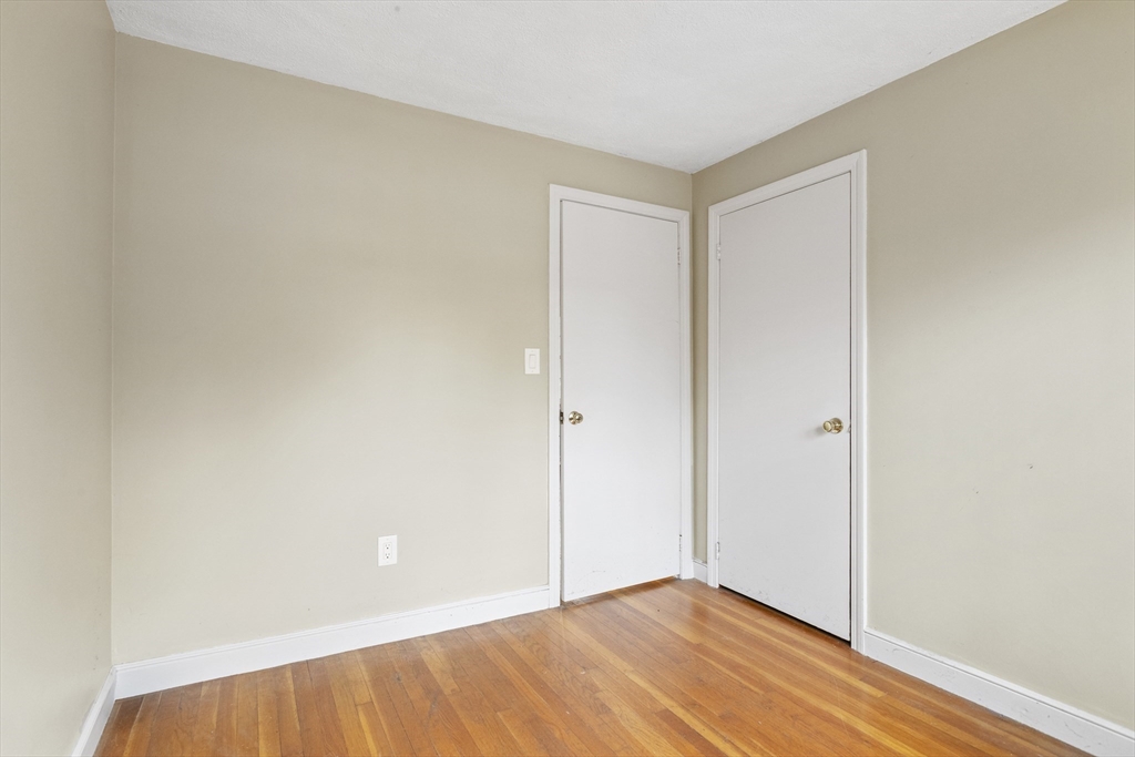 283 Orchard Street Millis, MA 02054 - Photo 20 of 41 a view of an empty room with wooden floor