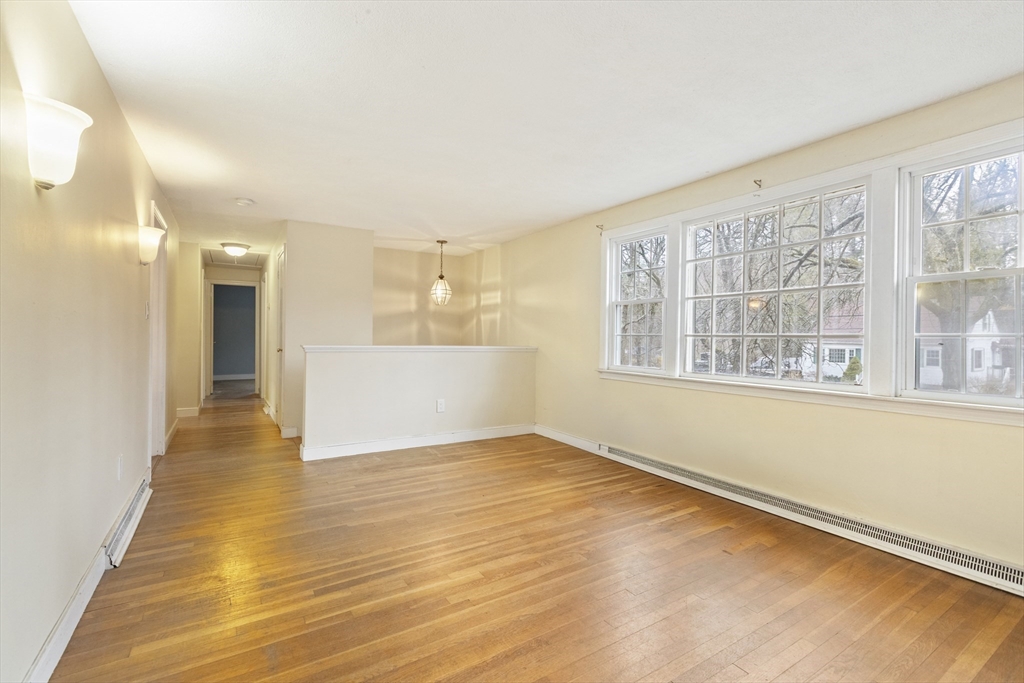 283 Orchard Street Millis, MA 02054 - Photo 2 of 41 a view of an empty room with a window