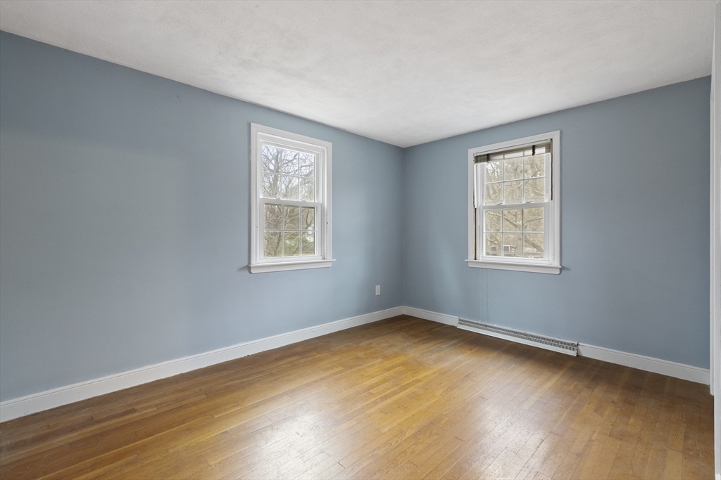 283 Orchard Street Millis, MA 02054 - Photo 23 of 41 a view of a room with wooden floor and windows