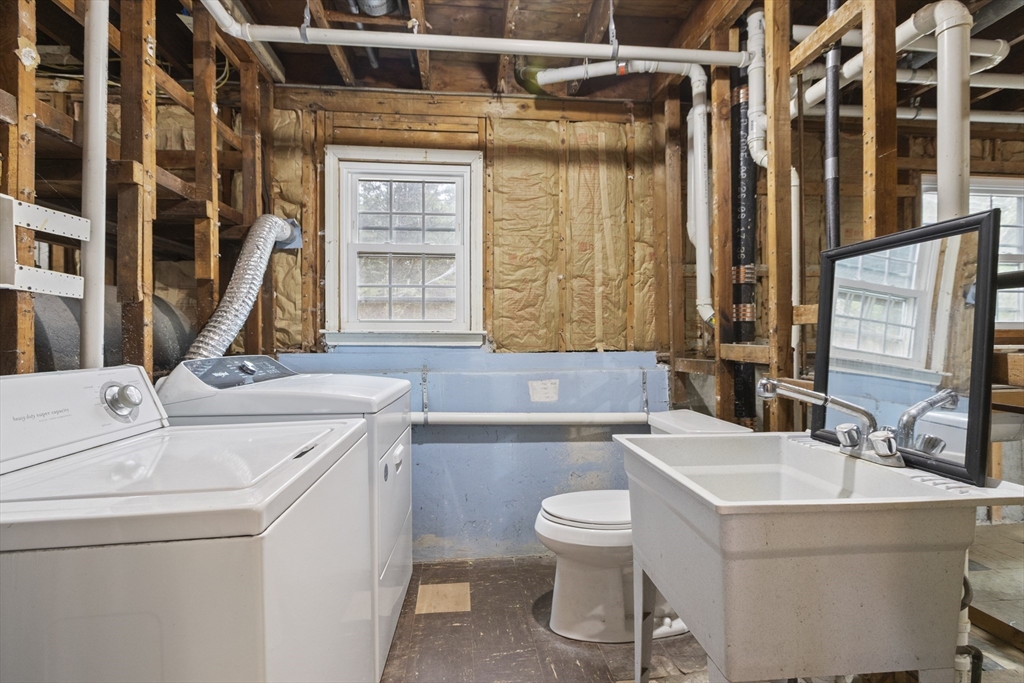 283 Orchard Street Millis, MA 02054 - Photo 27 of 41 a bathroom with a sink and a large mirror