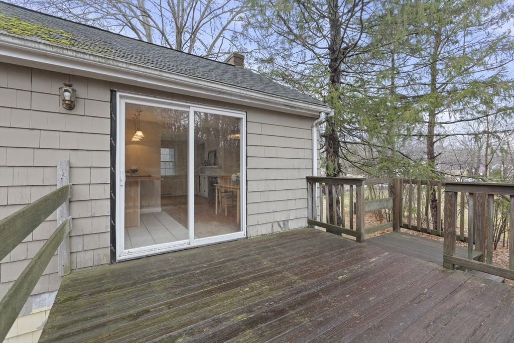 283 Orchard Street Millis, MA 02054 - Photo 31 of 41 a view of livingroom with deck and floor to ceiling window