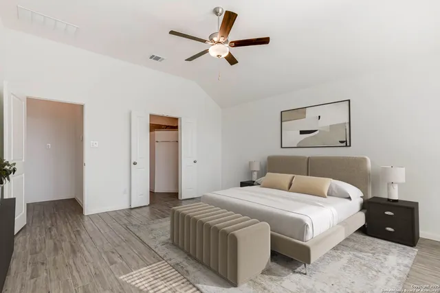 a bathroom with a double vanity sink mirror and next to a window