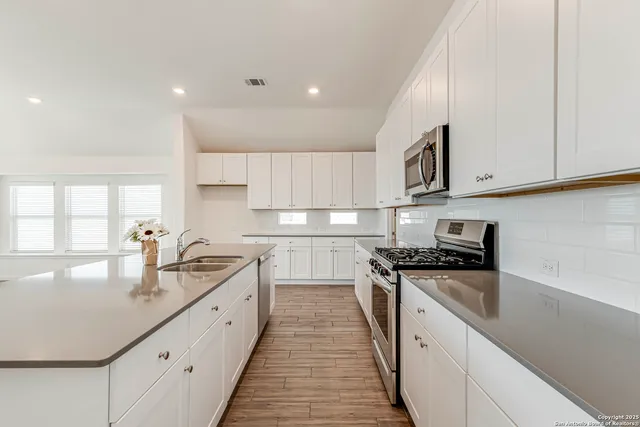 a bedroom with a bed and a ceiling fan