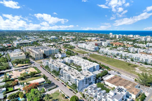 an aerial view of city and lake