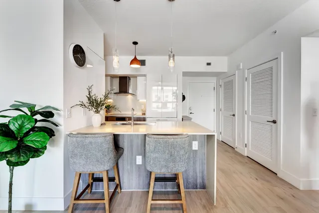 a view of kitchen island with furniture and wooden floor