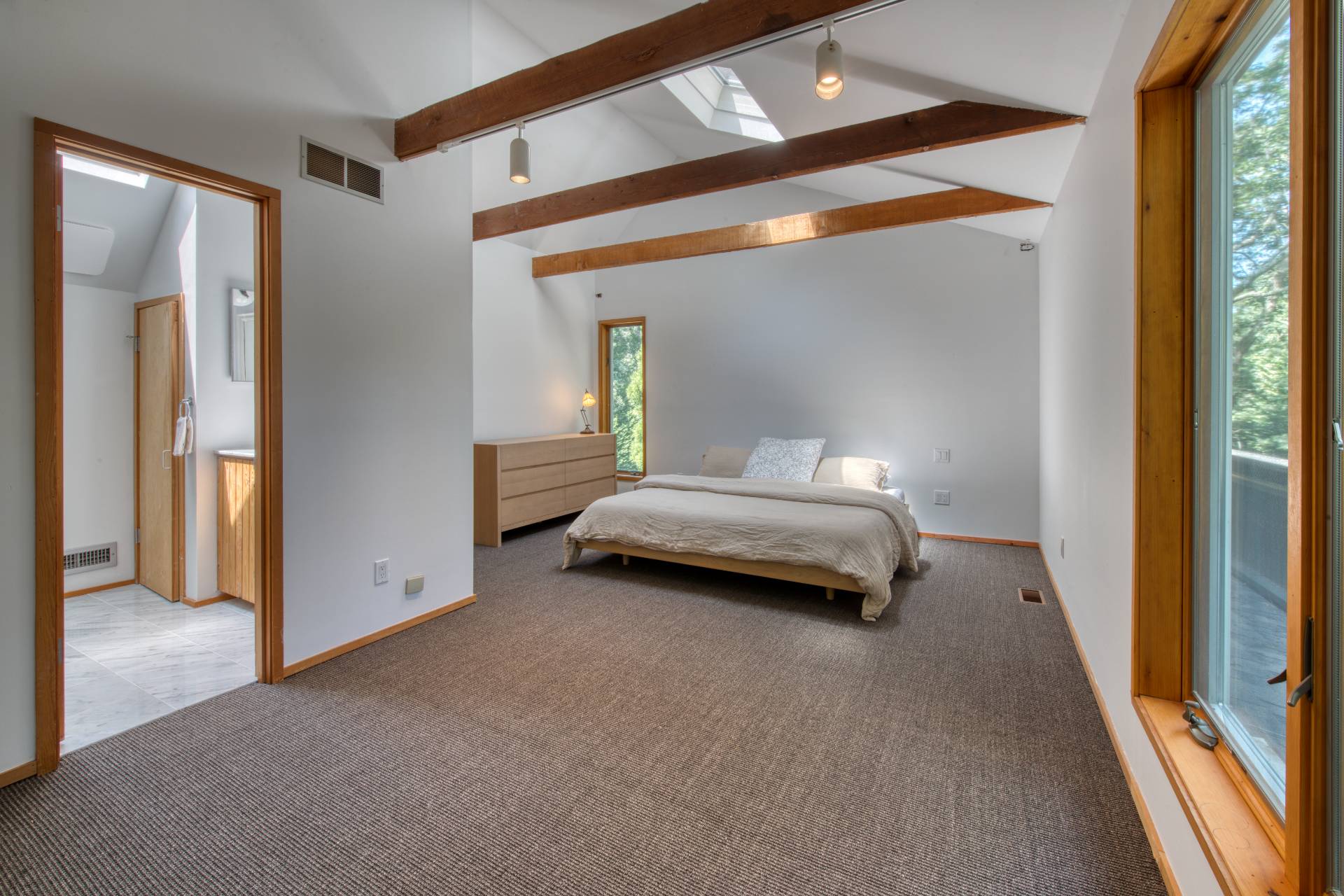 6 Eli Circle East Hampton, NY 11937 - Photo 15 of 29 a bedroom with a bed and a mirror