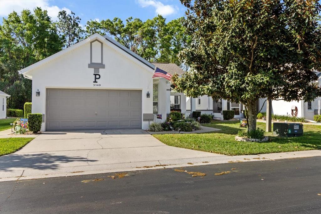3569 South Belgrave Drive Inverness, FL 34452 - Photo 2 of 70 a view of a house with a yard