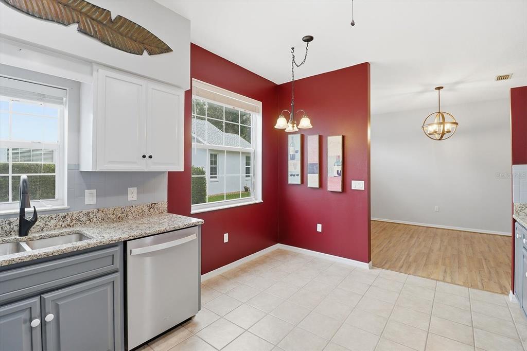 3569 South Belgrave Drive Inverness, FL 34452 - Photo 21 of 70 a kitchen with granite countertop a sink cabinets and wooden floor