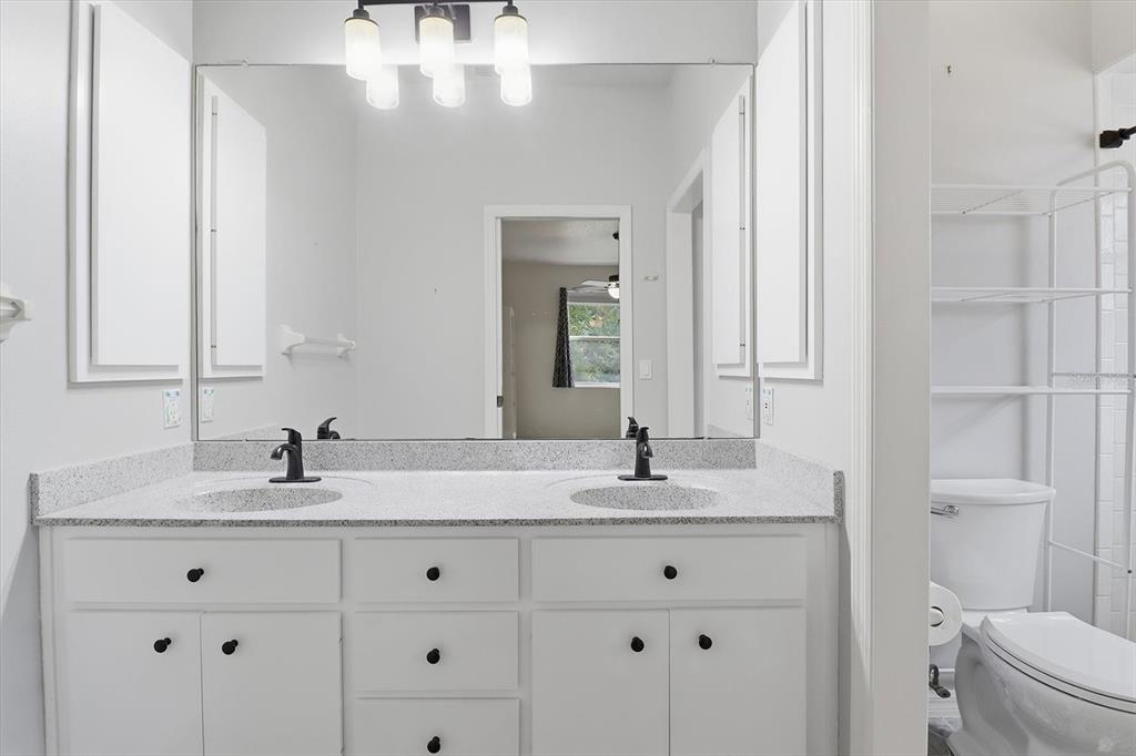 3569 South Belgrave Drive Inverness, FL 34452 - Photo 27 of 70 a bathroom with a granite countertop sink and a mirror