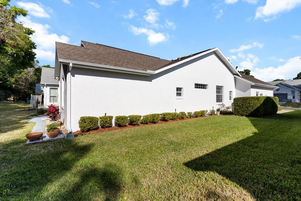 3569 South Belgrave Drive Inverness, FL 34452 - Photo 40 of 70 a view of a backyard with plants and a patio